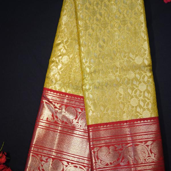 Kanchipattu silk yellow brocade saree with red border
